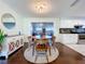 Dining room area with decorative hutch, hardwood floors, and access to the living and kitchen area at 8848 56Th N Way, Pinellas Park, FL 33782