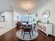 Open concept dining room that flows into the living room with hardwood floors throughout at 8848 56Th N Way, Pinellas Park, FL 33782