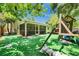 Exterior view of home from artificial turf backyard at 9041 58Th N St, Pinellas Park, FL 33782