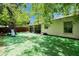 View of home from backyard with artificial turf and playset at 9041 58Th N St, Pinellas Park, FL 33782