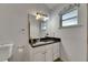 Bathroom features a modern vanity, granite countertop, and a window at 9041 58Th N St, Pinellas Park, FL 33782