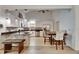 Modern kitchen with white cabinetry, granite countertops, stainless steel appliances, and an island with seating at 9041 58Th N St, Pinellas Park, FL 33782