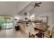Bright kitchen features stainless steel appliances, granite countertops and a breakfast nook with backyard view at 9041 58Th N St, Pinellas Park, FL 33782