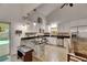 Modern kitchen with white cabinetry, granite countertops, stainless steel appliances, and an island with seating at 9041 58Th N St, Pinellas Park, FL 33782