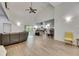 Spacious living room featuring vaulted ceilings, wood floors, and an open layout connected to the kitchen at 9041 58Th N St, Pinellas Park, FL 33782