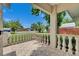 Cozy front porch with tile flooring and decorative railings, perfect for enjoying the outdoors at 9041 58Th N St, Pinellas Park, FL 33782
