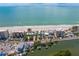 Panoramic aerial view showcasing beachfront properties along the tranquil shoreline with calm blue ocean waters at 20060 Gulf Blvd, Indian Shores, FL 33785