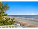 Balcony features views of white sand beach and blue ocean waters at 20060 Gulf Blvd, Indian Shores, FL 33785