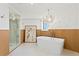 A sleek freestanding tub is paired with modern fixtures and an eye-catching art piece at 20060 Gulf Blvd, Indian Shores, FL 33785