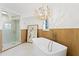A sleek freestanding tub is paired with modern fixtures and an eye-catching art piece at 20060 Gulf Blvd, Indian Shores, FL 33785
