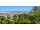Picturesque view of the sandy beach and clear ocean waters at 20060 Gulf Blvd, Indian Shores, FL 33785