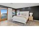 Bedroom features a neutral palette, a comfy bed, and views of the ocean at 20060 Gulf Blvd, Indian Shores, FL 33785