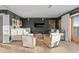 Sitting area with modern furnishings, television, and view of the water at 20060 Gulf Blvd, Indian Shores, FL 33785