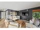 Sitting area boasts cozy furniture, a dark accent wall and a tv at 20060 Gulf Blvd, Indian Shores, FL 33785