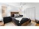 Cozy bedroom with a ceiling fan, a full closet and two bedside tables with lamps at 20060 Gulf Blvd, Indian Shores, FL 33785