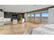 Bright bedroom with ocean views features seating area, tv and floor to ceiling windows at 20060 Gulf Blvd, Indian Shores, FL 33785