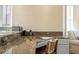 Convenient desk nook featuring granite countertops and custom cabinetry within the main living area at 20060 Gulf Blvd, Indian Shores, FL 33785