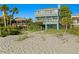 Beautiful beach house with multiple balconies offering stunning views of the ocean at 20060 Gulf Blvd, Indian Shores, FL 33785