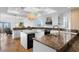 Bright kitchen boasts granite countertops, white cabinetry, and travertine flooring, seamlessly blending style with functionality at 20060 Gulf Blvd, Indian Shores, FL 33785