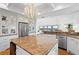 Gourmet kitchen featuring granite counters, stainless appliances, and ample storage with direct access to outdoor living at 20060 Gulf Blvd, Indian Shores, FL 33785