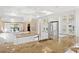 Bright kitchen with stainless steel appliances, granite countertops, white cabinetry, and breakfast bar seating at 20060 Gulf Blvd, Indian Shores, FL 33785