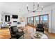 Spacious living room with a fireplace, comfortable seating, and a picturesque view of the ocean at 20060 Gulf Blvd, Indian Shores, FL 33785
