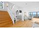 Bright living room with hardwood floors, a fireplace, and access to the ocean view at 20060 Gulf Blvd, Indian Shores, FL 33785