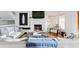Inviting living room boasts a fireplace, plush seating, and an adjacent staircase, creating a relaxing atmosphere at 20060 Gulf Blvd, Indian Shores, FL 33785