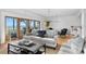 Bright living room with hardwood floors, comfortable seating and a picturesque view of the beach at 20060 Gulf Blvd, Indian Shores, FL 33785