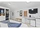 Bright primary bedroom featuring built-in shelving and plenty of natural light at 20060 Gulf Blvd, Indian Shores, FL 33785