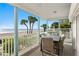 Charming covered patio area with comfortable seating and an ocean view at 20060 Gulf Blvd, Indian Shores, FL 33785