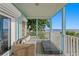 Relaxing covered patio featuring comfortable seating and an amazing ocean view at 20060 Gulf Blvd, Indian Shores, FL 33785