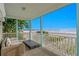Relaxing covered patio featuring comfortable seating and an amazing ocean view at 20060 Gulf Blvd, Indian Shores, FL 33785