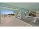Spacious covered patio with a view of the ocean, perfect for entertaining at 20060 Gulf Blvd, Indian Shores, FL 33785