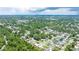 Expansive aerial view showcasing a vibrant residential community with lush green trees and well-maintained homes at 11116 118Th St, Seminole, FL 33778