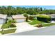 Overhead view of a home showcasing its driveway, well-manicured lawn, and landscaping at 11116 118Th St, Seminole, FL 33778