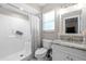 Bathroom featuring a walk-in shower, modern vanity, and tile flooring at 11116 118Th St, Seminole, FL 33778