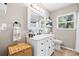 Clean and bright bathroom features white vanity with marble counter, classic fixtures, and natural light at 11116 118Th St, Seminole, FL 33778