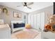Cozy ' bedroom with a crib, changing table, closet, and playful decor at 11116 118Th St, Seminole, FL 33778
