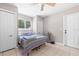 Cozy bedroom featuring a ceiling fan, tile floors, and ample natural light at 11116 118Th St, Seminole, FL 33778