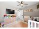 Bright bedroom with a crib, changing table, storage cubes, and playful decor at 11116 118Th St, Seminole, FL 33778