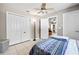 Comfortable bedroom with a ceiling fan, large closets and a door to the other rooms at 11116 118Th St, Seminole, FL 33778