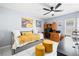 Light-filled bedroom with daybed, desk, fan, and plenty of space for relaxation and productivity at 11116 118Th St, Seminole, FL 33778