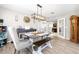 Bright dining room featuring a modern light fixture and doorway to the living room at 11116 118Th St, Seminole, FL 33778