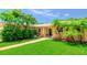 Attractive single-Gathering home with mature landscaping and a brick walkway leading to the front entry at 11116 118Th St, Seminole, FL 33778