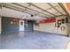 Well-lit garage featuring epoxy floors, ample storage, and a well-organized workspace at 11116 118Th St, Seminole, FL 33778