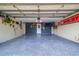 Spacious garage with epoxy floors, ample storage, and a well-organized workspace at 11116 118Th St, Seminole, FL 33778