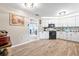 Bright kitchen featuring white cabinetry, modern appliances, and an adjacent dining area at 11116 118Th St, Seminole, FL 33778