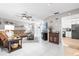 Cozy living room with tile floors, comfortable furnishings, and an open view into the kitchen at 11116 118Th St, Seminole, FL 33778