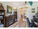 Home office with a fireplace, a large window, and an open entry into the dining area at 11125 Shelter Cove Loop, New Port Richey, FL 34654